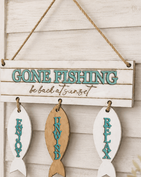 “Gone Fishing – Be Back at Sunset” wooden hanging sign.